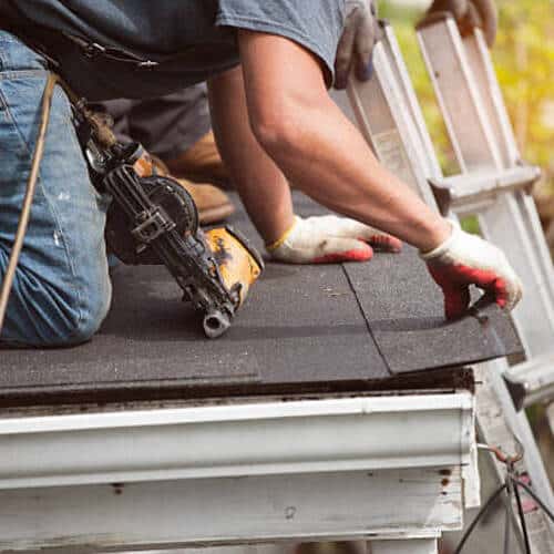worker providing roof restoration services